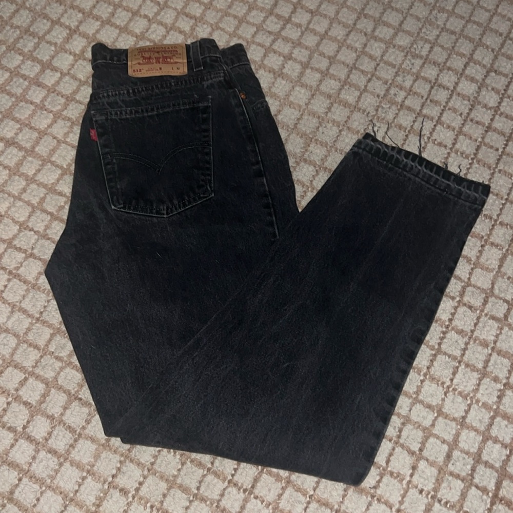 vintage black denim levis with let out bottom hem